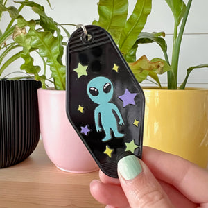 keychain with a alien and stars
