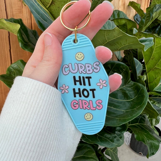 motel keychain that says curbs hit hot girls