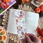 fall themed bookmark with ghosts, pumpkins, smiley faces and fall drinks