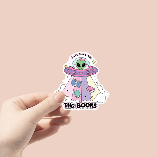 alien in spaceship that says "just here for the books" sticker