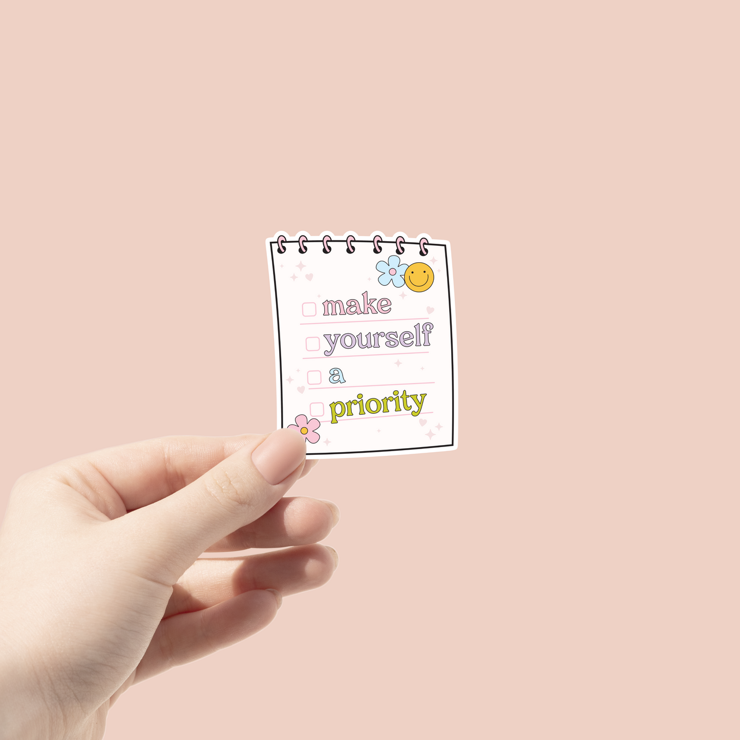 notepad sticker with Make Your self a Priority written on it and check marks