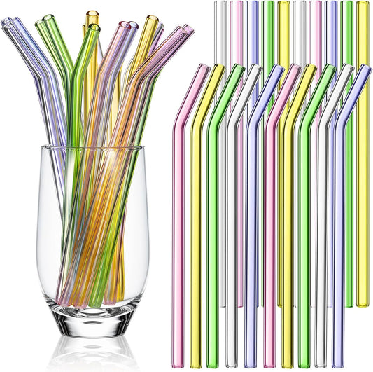 A set of pastel-colored glass straws, with options of curved or straight, displayed in a clear glass.
