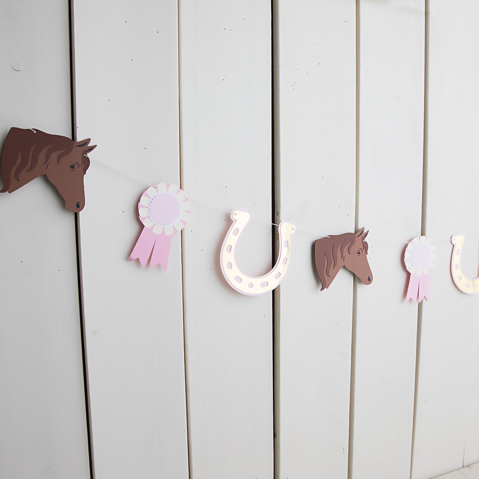 pony tales paper garland with horses, horseshoes and awards