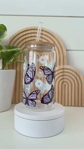 lavender butterfly cup with bamboo lid and glass straw on turntable