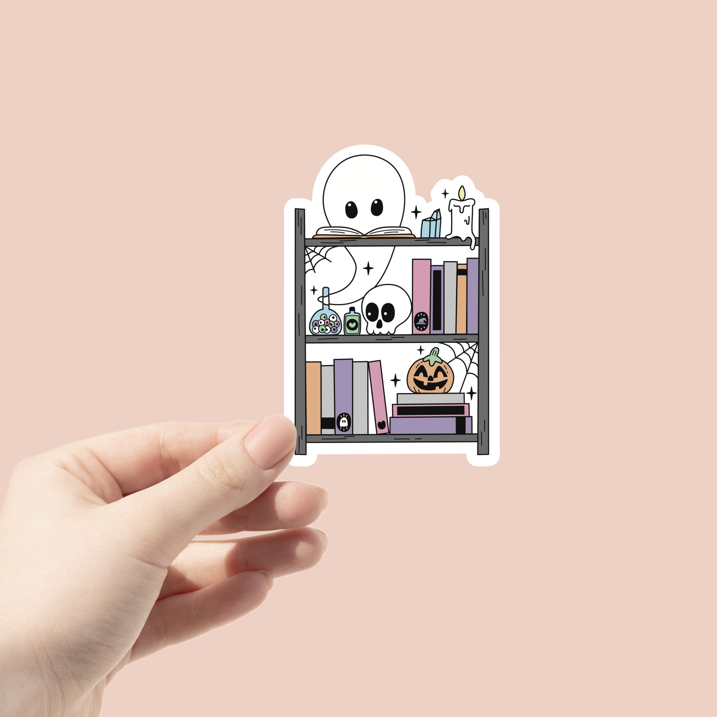 spooky bookshelf sticker with ghost and skulls display on it