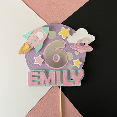 outer space themed cake topper with childs name